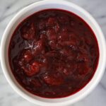 homemade cranberry sauce in a small white bowl.
