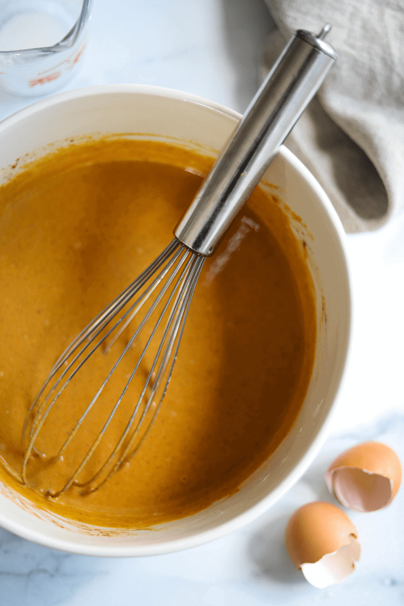 Pumpkin pie filling in a mixing bowl