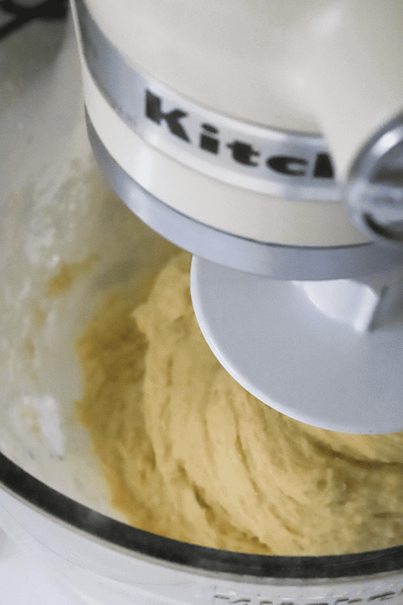 This image shows an overhead view of dough in a stand mixer