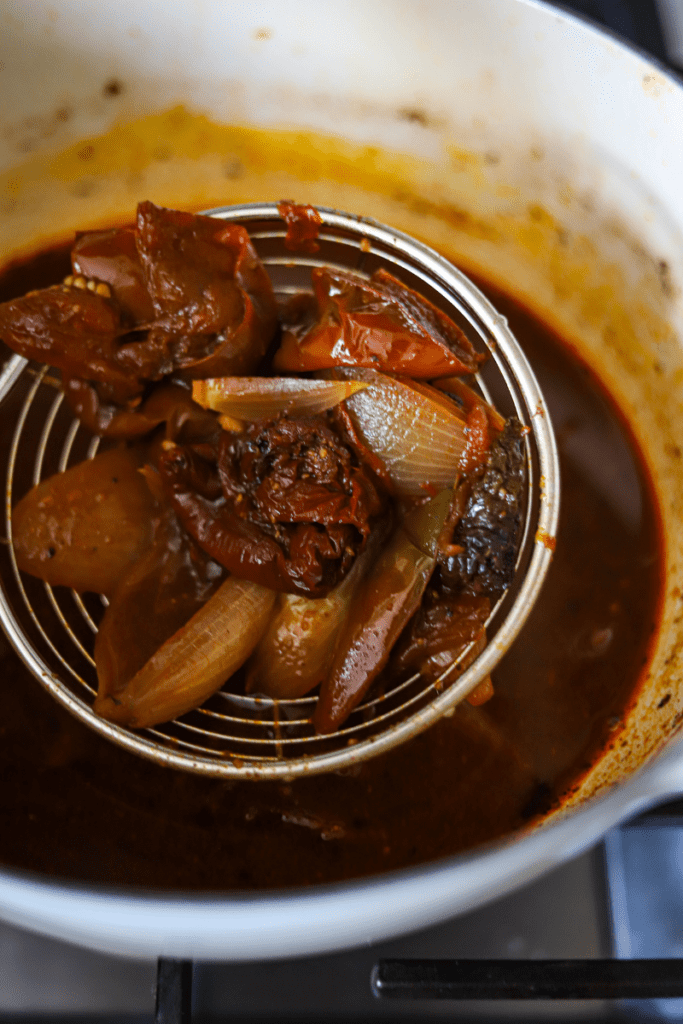 Close up of stewed onions and peppers used to make Mexican birria