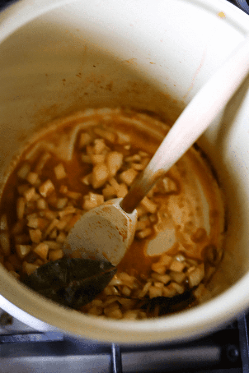 This is a photo of stewed onions and tomatoes - the photo's purpose is to demonstrate the early stages of making Cape Verdean canja