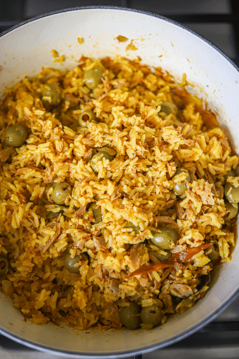 This is a photo of Cape Verdean rice with tuna (arroz de atum) that's been cooked and fluffed with a fork.