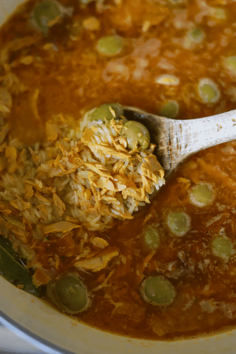 This is a photo of the rice being added to the pot in the preparation of Cape Verdean rice with tuna (arroz de atum)