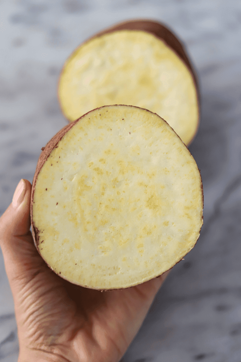 This is a close up photo that shows the inside of a batata doce (variant of sweet potato, also known as Japanese yam)