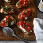 bruschetta topped with fresh tomatoes and burrata cheese