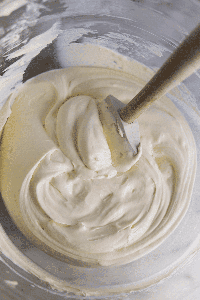 easy tiramisu recipe-whipped mascarpone cream in a glass mixing bowl