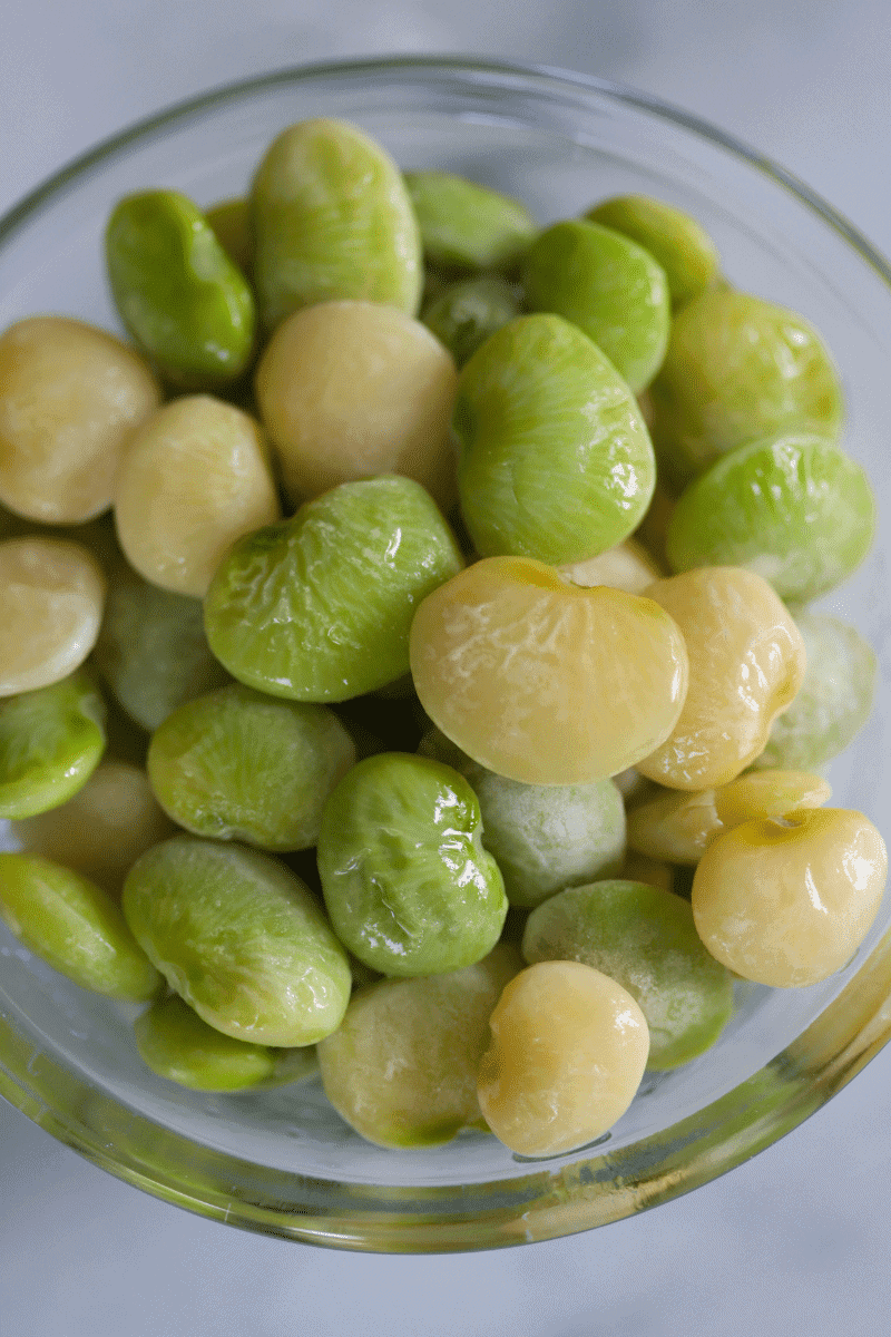 Close up photo of frozen Fordhook lima beans in a glass bowl