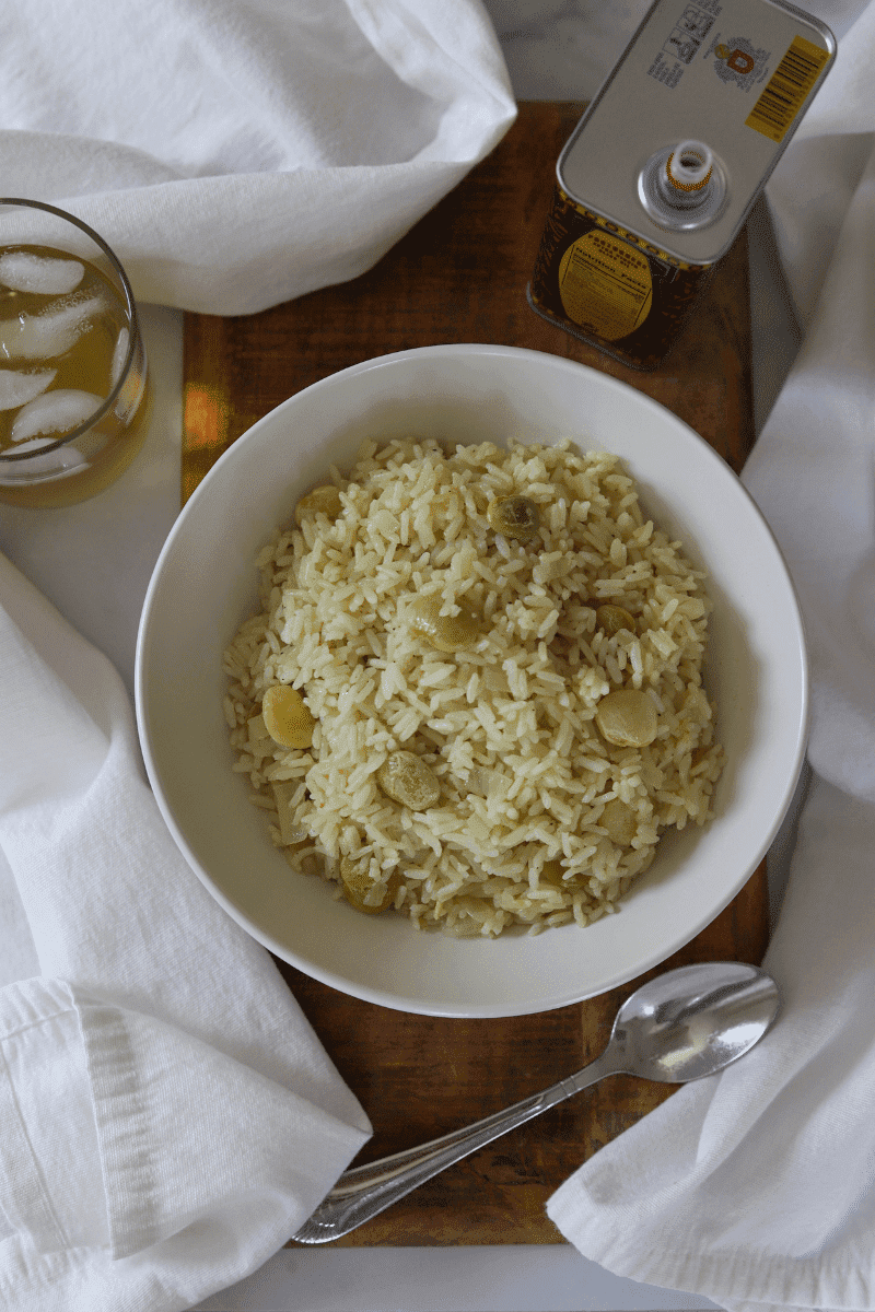 Close up photo of Cape Verdean style white rice with lima beans in a bowl