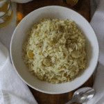 Close up photo of Cape Verdean style white rice with lima beans in a bowl