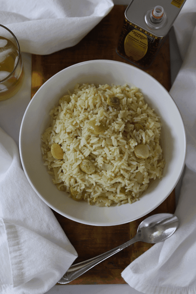 Close up photo of Cape Verdean style white rice with lima beans in a bowl