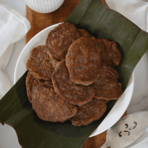 Cape Verdean banana fritters (brinhola) on a plate served with cup of coffee