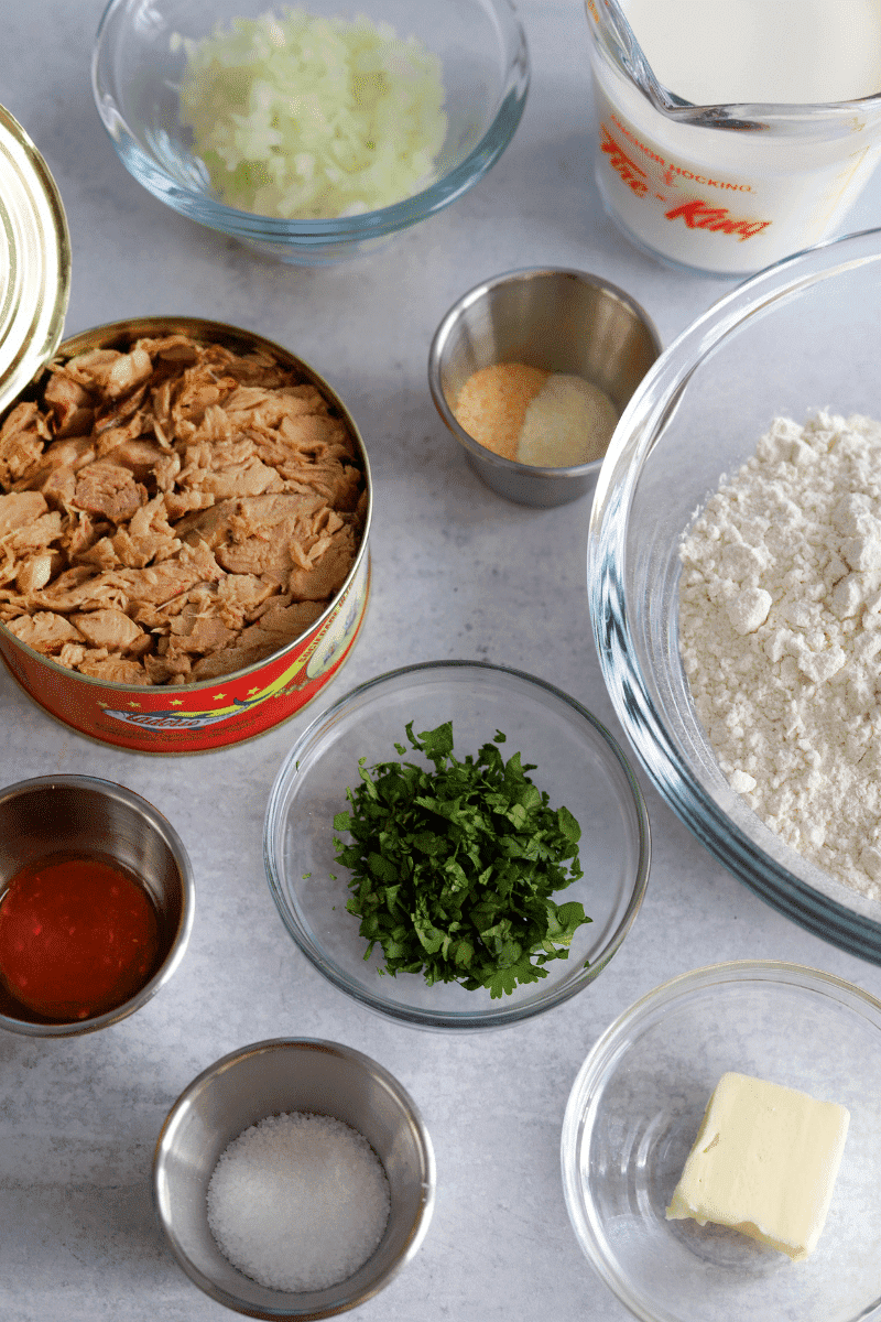 ingredients for tuna rissois (clockwise): minced onions, milk, garlic and onion powder, all-purpose flour, cilantro, butter, kosher salt, hot sauce, canned tuna