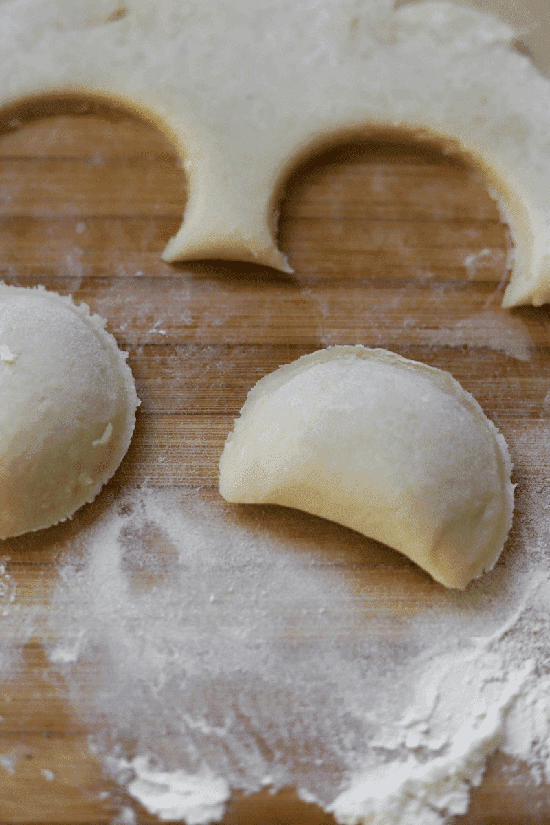 process shot showing un-breaded rissois stamped out of the dough