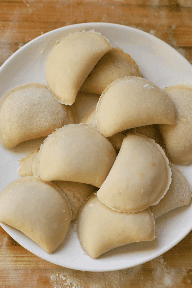 assembled, unbreaded, rissois on a plate before frying