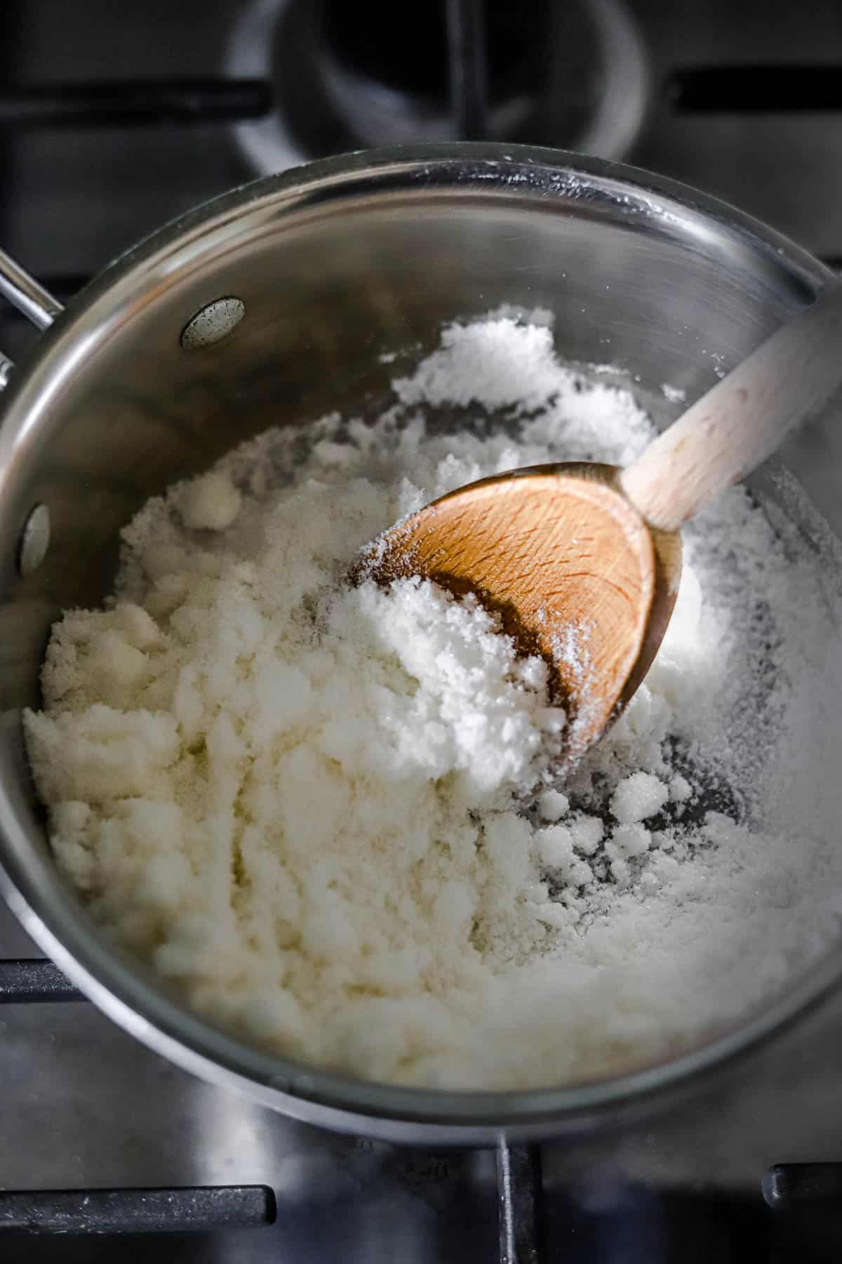 recipe process shot of heating granulated sugar for green papaya jam