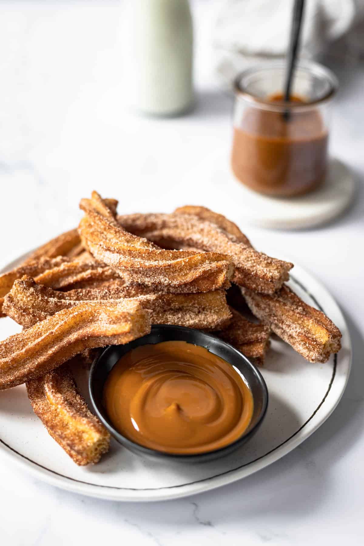 cinnamon sugar churros with a side of dulce de leche