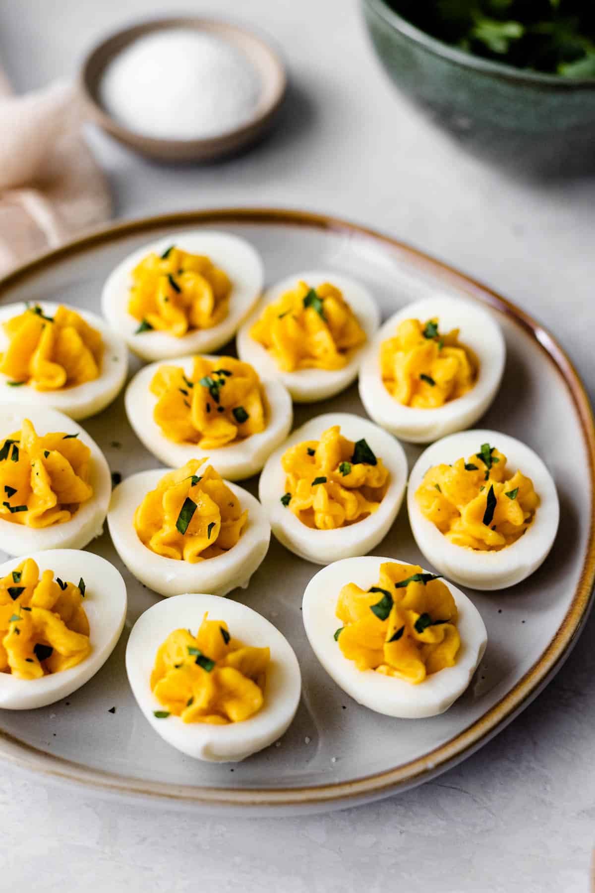 piped deviled eggs with miracle whip on a platter