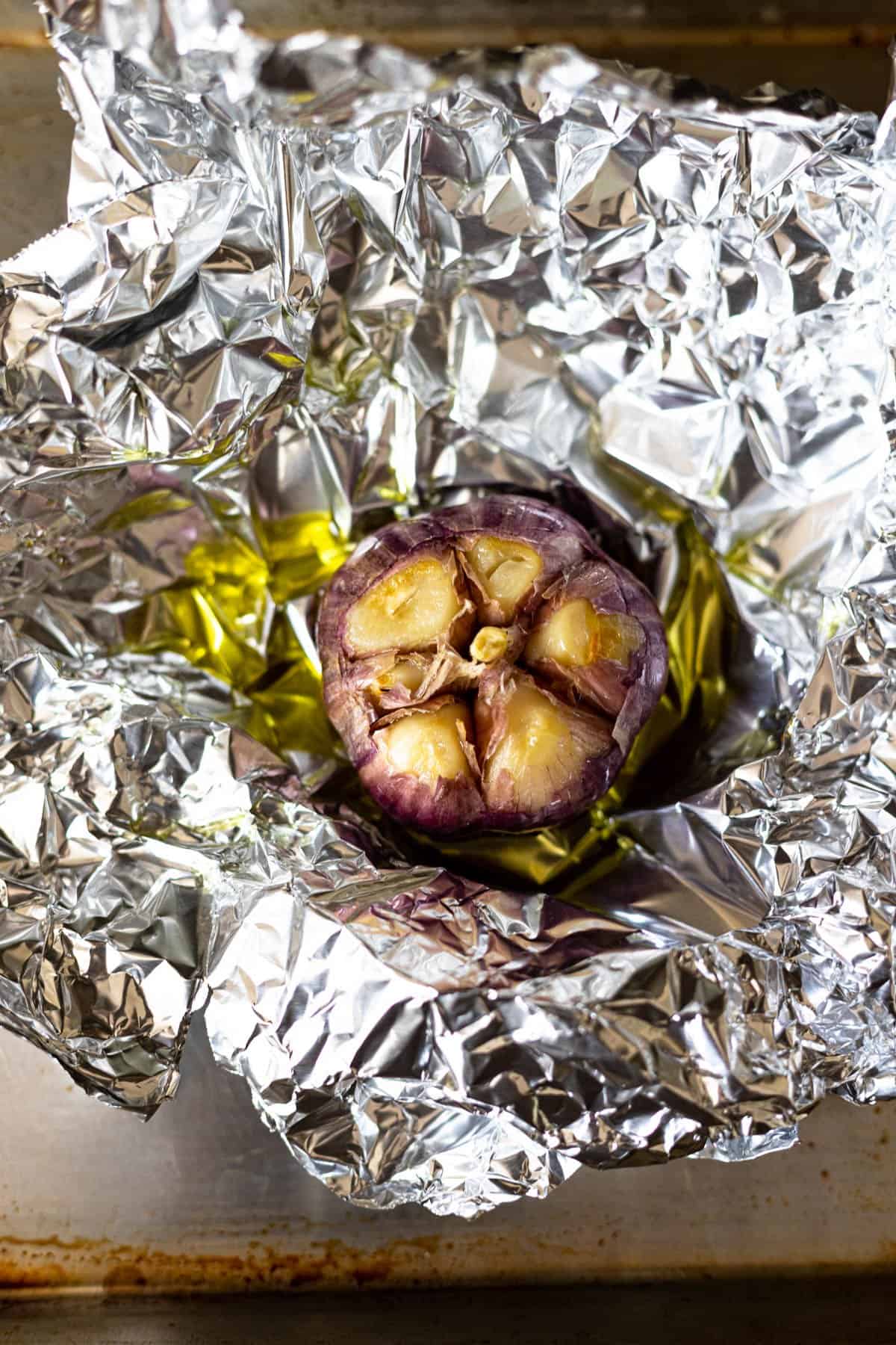 a roasted garlic bulb in foil