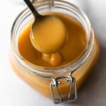 golden doce de leite on a spoon