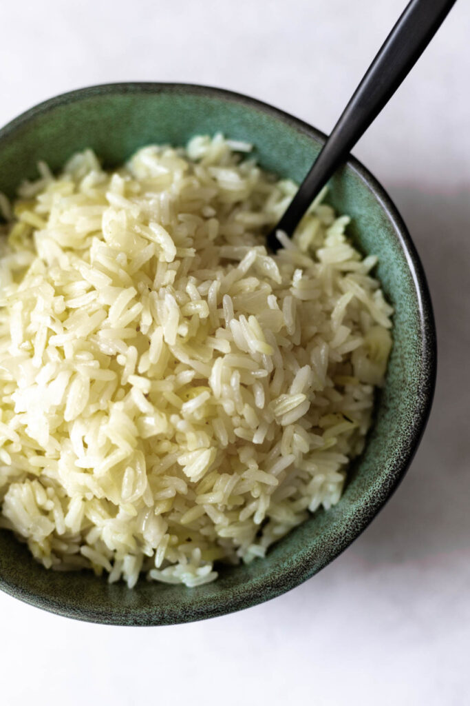 seasoned white rice in a green bowl