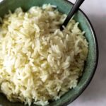 seasoned white rice in a green bowl
