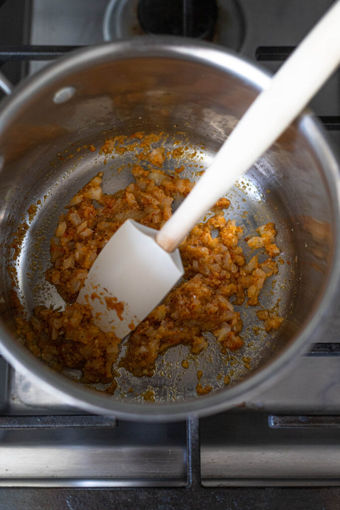 onions garlic and seasonings in a pan