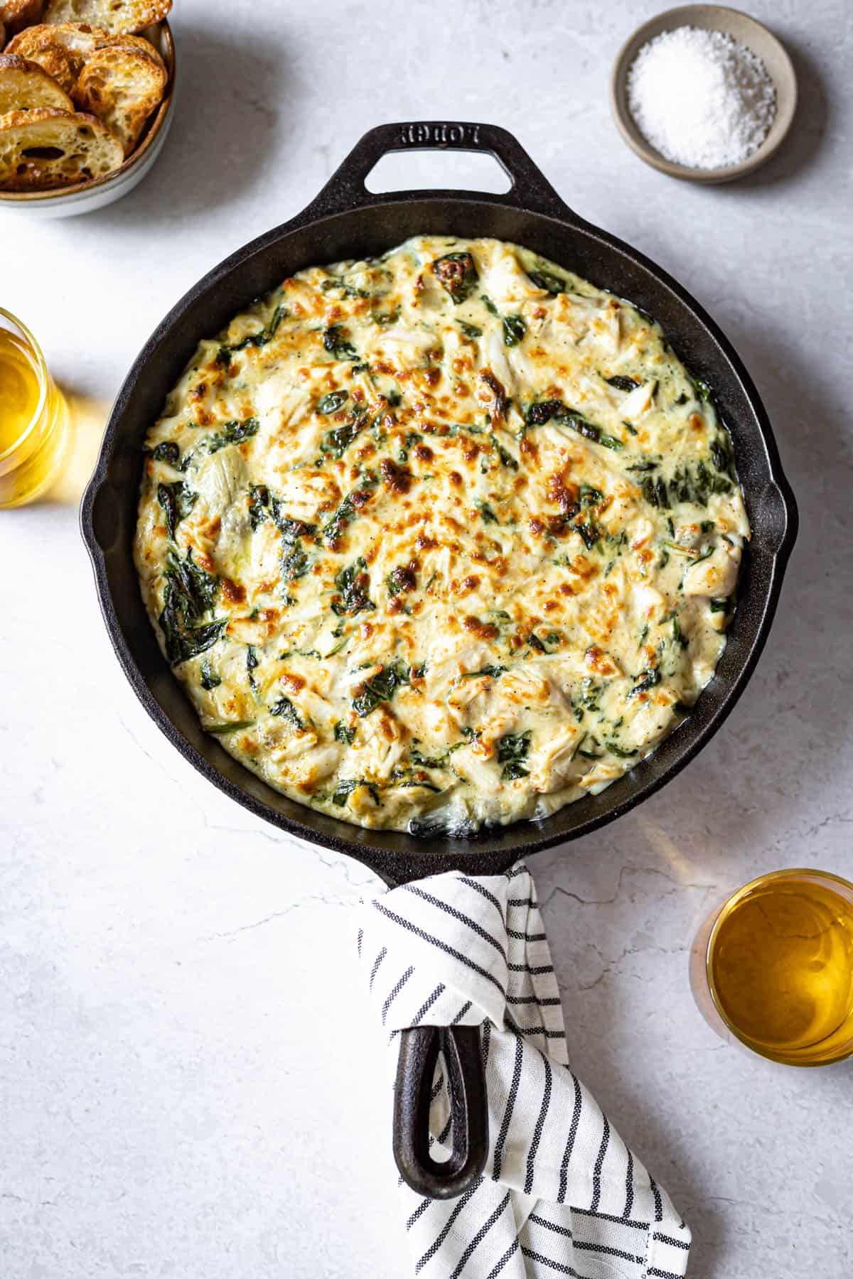 fully prepared spinach and crab dip in a black skillet