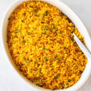 spanish yellow rice in a round serving dish.